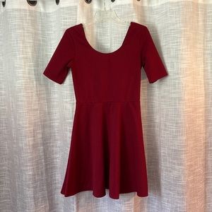 Red, patterned, fit and flare dress with half sleeves.